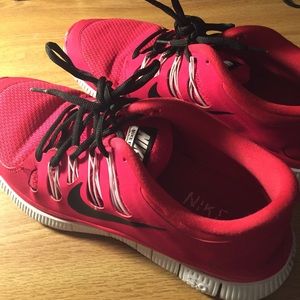 Red Nike tennis shoes